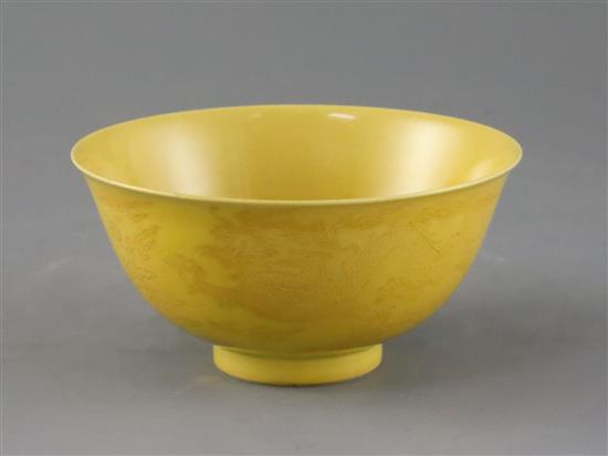 A Chinese yellow glazed sgraffito dragon bowl, Qianlong seal mark and of the period (1736-95), Diam.13.3cm, restored
